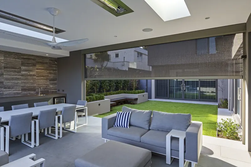 Motorized outdoor shades on a patio
