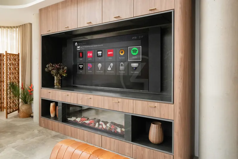A media wall with a large screen showing a smart home dashboard